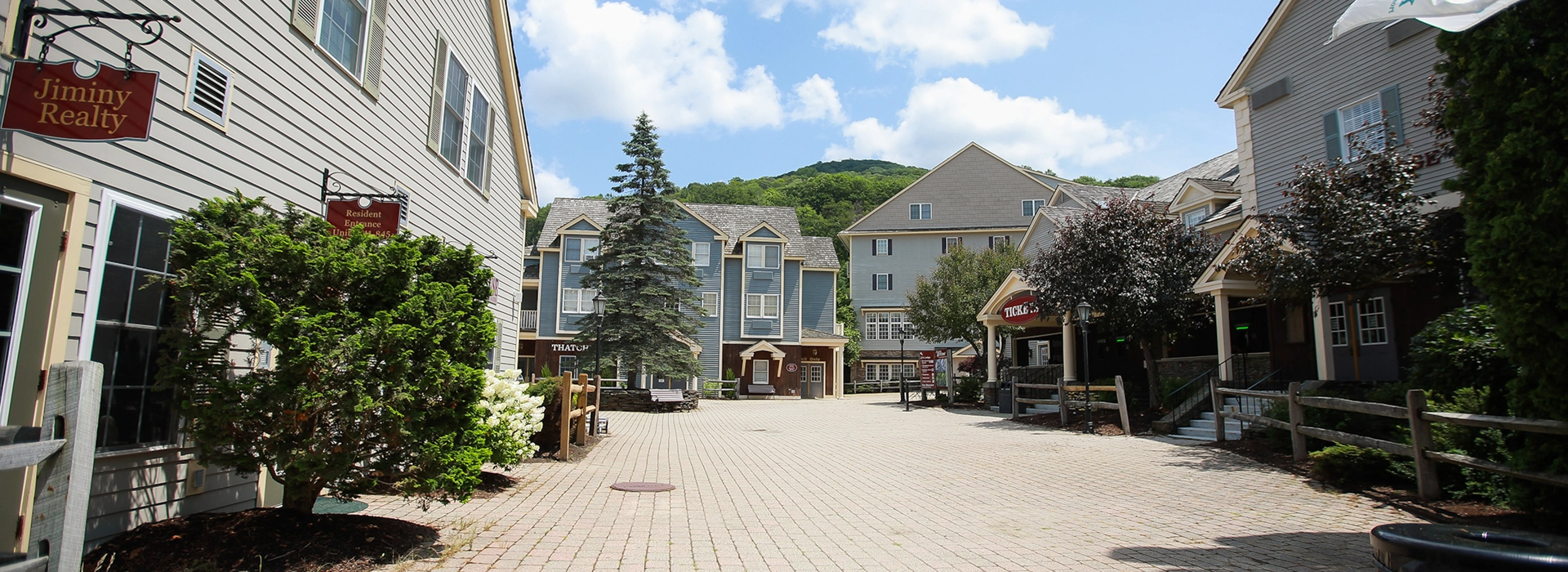 Brick courtyard between Jiminy Realty office and Crane Lodge condominiums at Jiminy Peak village base